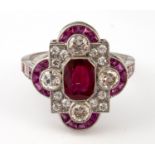 An Edwardian style platinum ruby and diamond dress ring, ring size M central ruby 1.65ct approx.