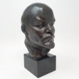 A spelter bust of Vladimir Lenin, on a polished marble base, 21 cm high