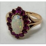 A 19th century ruby and opal ring, ring size M