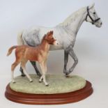 A Border Fine Arts group, Thoroughbred Mare and Foal, limited edition 304/1500, by Anne Wall, with