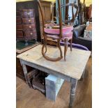 A pine kitchen table and a pair of 19th century mahogany balloon back chairs (2)