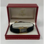 A ladies silver gilt Must De Cartier wristwatch, with box and papers