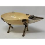 A shell, with Chinese silver coloured metal mounts, decorated a crab and fish, on a simulated bamboo