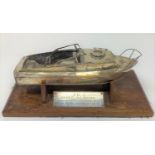 A silver plated model of a motor launch, slight loss, 24 cm wide, on a stand with a plaque J G J HMS