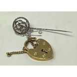 A 9ct gold padlock clasp, 4.0 g, and a diamond chip stick pin, lacks a stone (2)