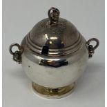 A Georg Jensen silver mustard pot and cover, 724, 7 cm high no 724, good condition
