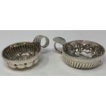 A French silver coloured metal wine taster, inscribed in J Barret, 11.5 cm, and another similar,