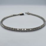 An 18ct gold diamond line bracelet Total length 19 cm, total diamond weight 4ct