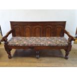 A 19th century style oak settle, 185 cm wide