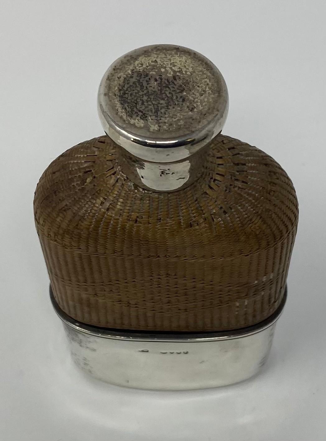 A Victorian glass, rattan mounted and silver flask, initialed, with detachable cup, marks indistinct - Image 2 of 2