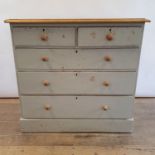 A painted pine chest, having two short and three long drawers, 103 cm wide