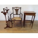 An early 20th century walnut marquetry armchair, a nest of three tables, and a towel rail (5)