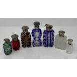 A group of seven Victorian and later glass scent bottles, mounts mostly damaged
