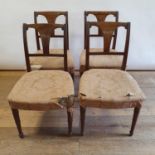 A set of four 19th century mahogany dining chairs, with padded seats, on turned tapering legs (4)