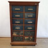 An early 20th century oak cartonnier, with twelve painted canvas fronted drawers, 165 cm high x