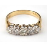 An 18ct gold and five stone diamond ring, ring size L1?2