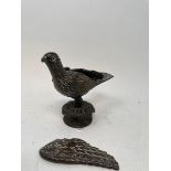 A bronze finial, in a form of a bird, one wing off, 14 cm high