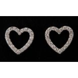 A pair of 18ct white gold and diamond set heart shaped earrings