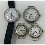 A silver trench type wristwatch, and three other similar (4)