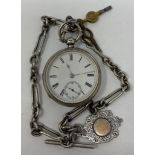 A silver open face pocket watch, with a silver Albert