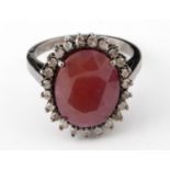 A ruby and diamond cluster ring, ring size O1?2