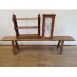 An oak bench, 178 cm wide, an oak wall shelf, 57 cm wide, and a pine cupboard with tiled door, 55 cm