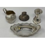 A late Victorian silver cream jug, Birmingham 1890, a small silver dish, 4.1 ozt, a silver capstan