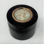 A tortoiseshell circular box and cover, the top inset a circular portrait miniature, of a lady