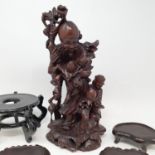 A Chinese carved figure of a man, various stands and other items (box)