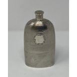 A large Victorian silver flask, with engraved decoration, and detachable cup, London 1851, 7.4