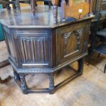 An 18th century style oak cupboard, with a single door, on carved legs united by stretchers, 180