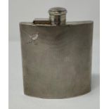 A silver hip flask, engraved a cock pheasant, and with engine turned decoration, initialed,