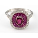 A platinum ruby and diamond halo set ring, ring size L