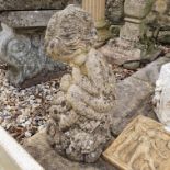 A Composite stone garden fountain head in the from of a child and a snail, 48 cm high, and a sink,