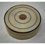 A 19th century tortoiseshell and ivory circular box and cover, initialed AW CDA, the interior of the