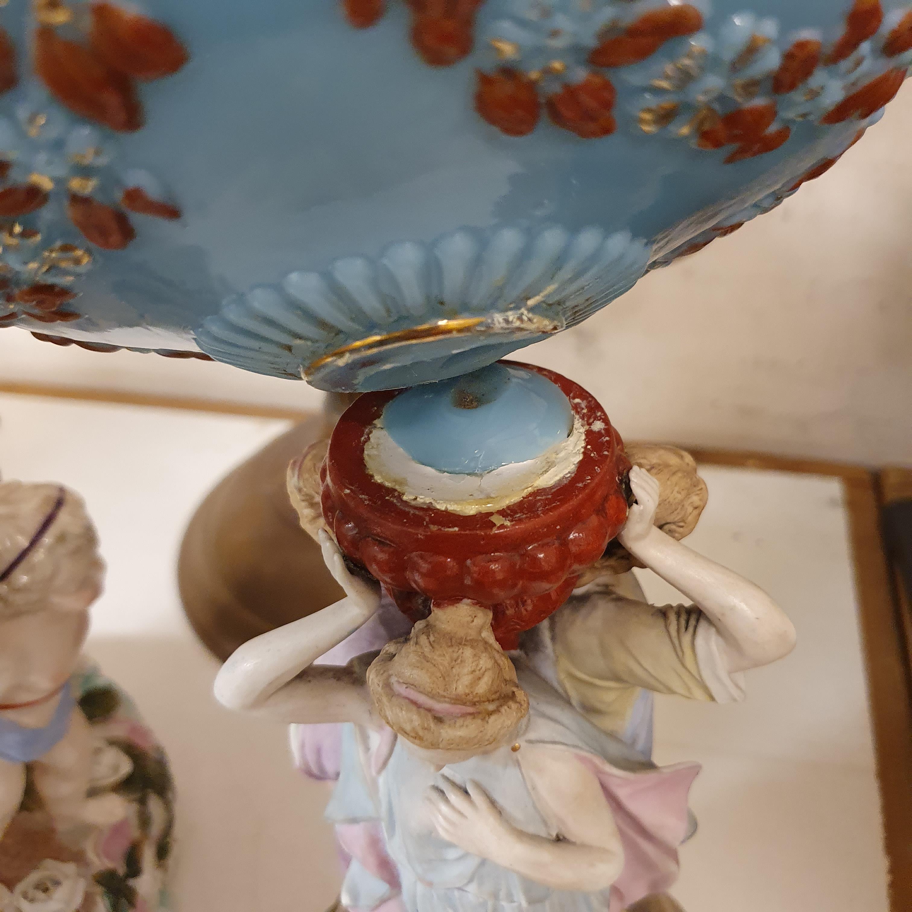 A Dresden porcelain oil lamp, flower encrusted well raised by three putti, 55 cm high, and an oil - Image 9 of 11