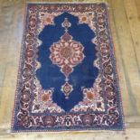 A Persian blue ground rug, main floral border, centre with shade medallion, 123 x 182 cm