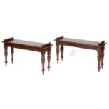 A pair of mahogany window seats, on turned tapering carved legs, 96 cm wide (2)