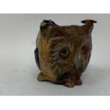 A novelty painted bronze ashtray, of triangular form, decorated the face of an owl, cat and a pug