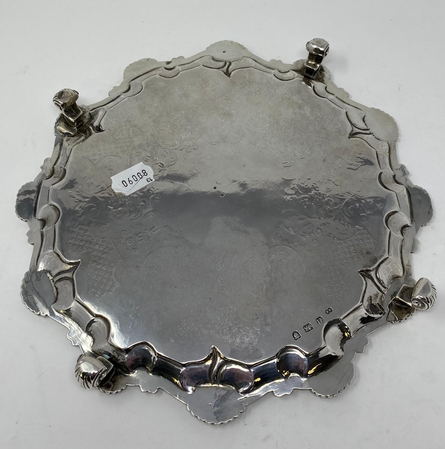 A late 18th century silver salver, later initialed within a garter, with a pie-crust edge, and - Image 2 of 3