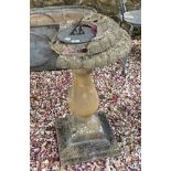 A composite stone sundial, large loss to the top, 83 cm high