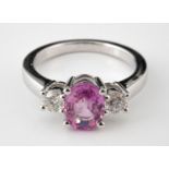 An 18ct gold oval-cut pink sapphire and diamond ring, ring size L Pink sapphire 1.5ct and diamonds