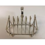 A novelty plated cricketing toast rack, 16.5 cm high Modern