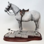 A Border Fine Arts group of a grey horse and a terrier, by Anne Wall, on a mahogany base, 34 cm