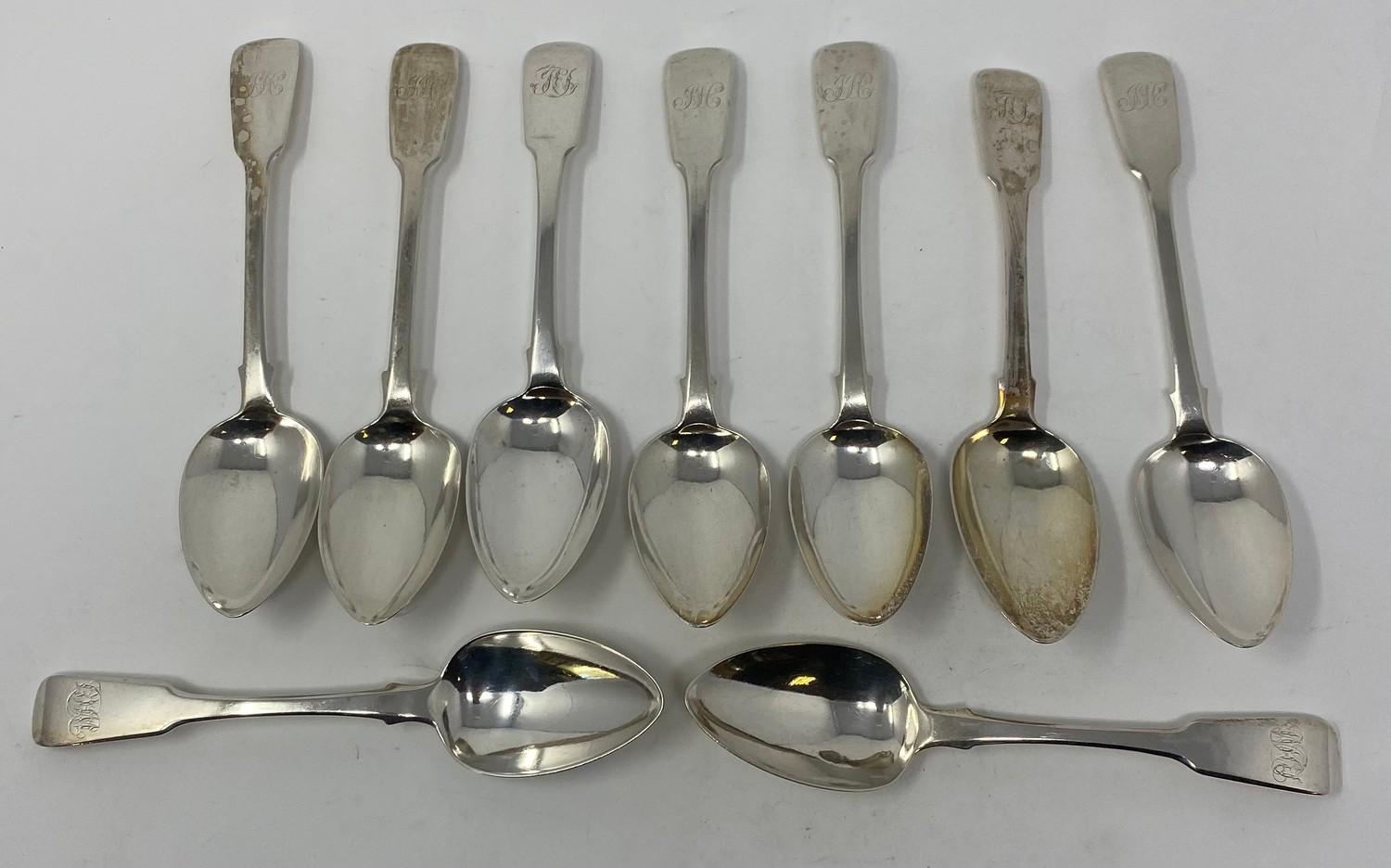 Nine silver fiddle pattern dessert spoons, initialed, various dates and makers, 12.2 ozt