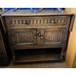 An 18th century style oak cupboard, with a single frieze drawer above two cupboard doors, 93 cm wide