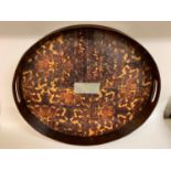 An oval tray, inset with faux tortoiseshell panels, 55 cm wide Modern