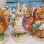 A Border Fine Arts Beatrix Potter figure, Old Mr Benjamin Bunny, and eleven other Border Fine Arts