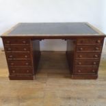 A 19th century partners mahogany desk, with pedestals, having five drawers, flanked by single drawer