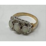 A 9ct gold, three oval stone opal and diamond ring Modern